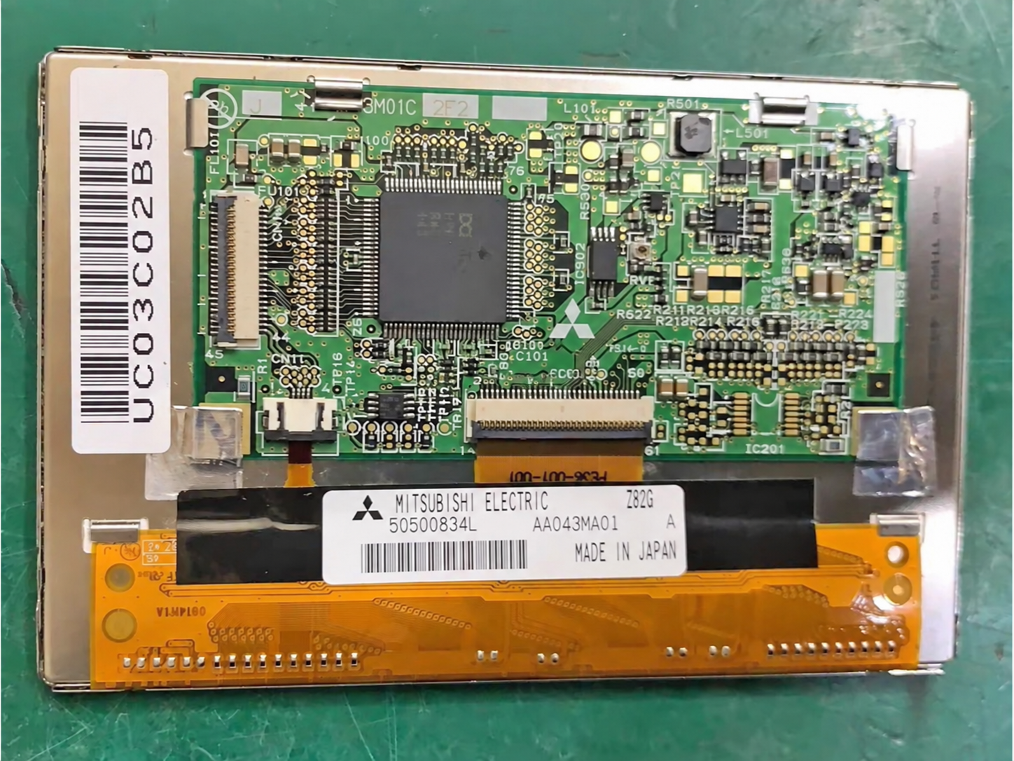 AA043MA01 rear-view reference with manufacturer label and connector