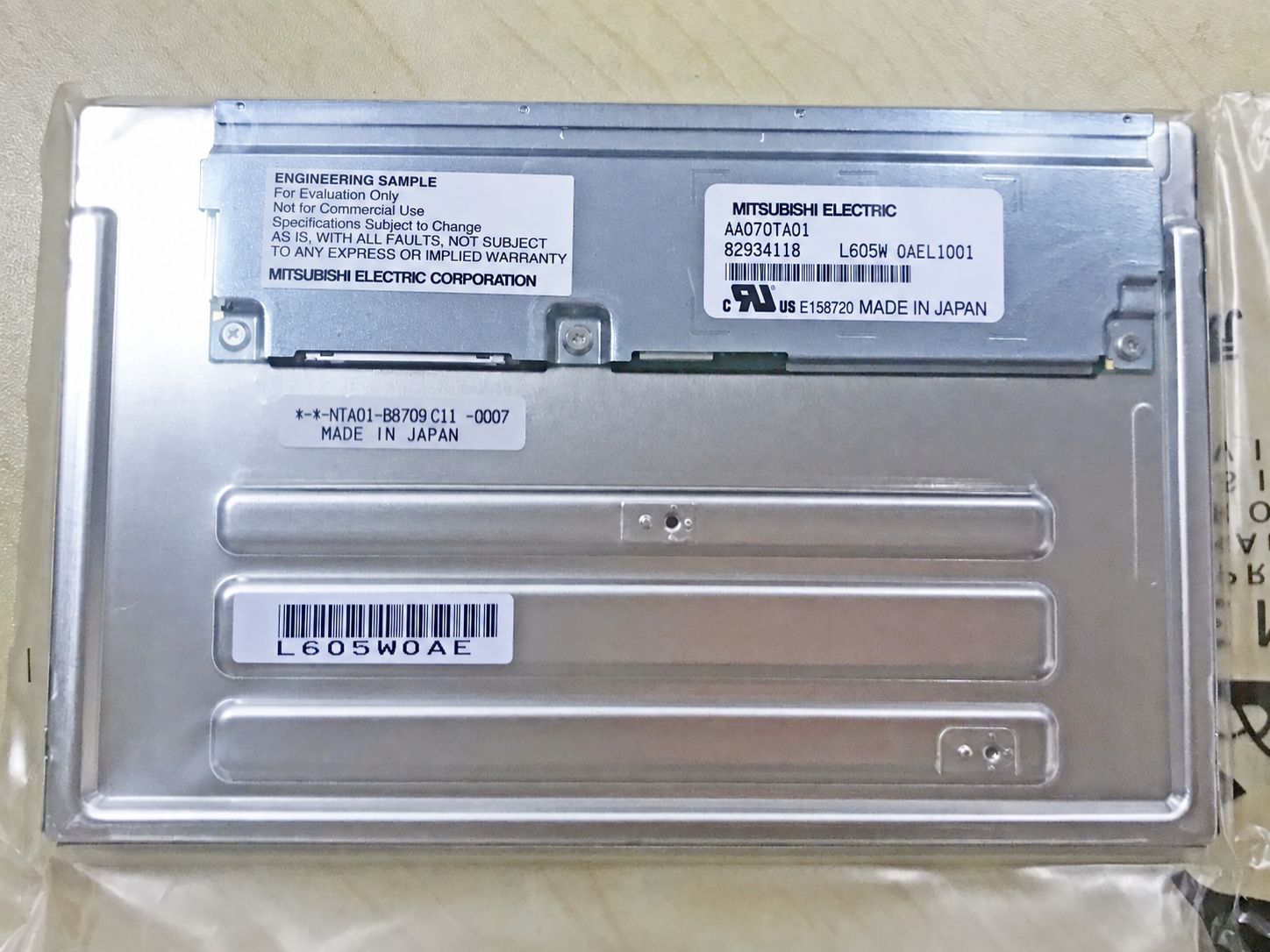 AA070TA01 rear-view reference with model label and circuit board